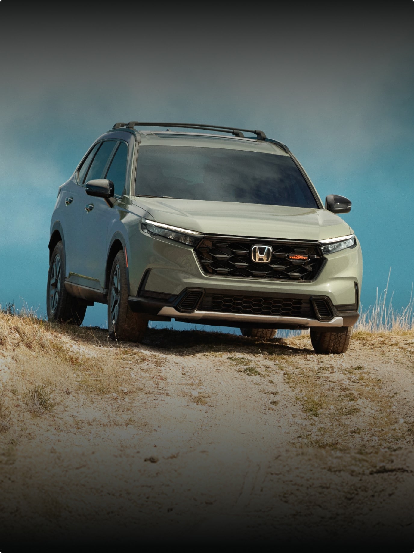 2026 Honda CR-V reveal image showing CR-V TrailSport Hybrid in Ash Green Metallic