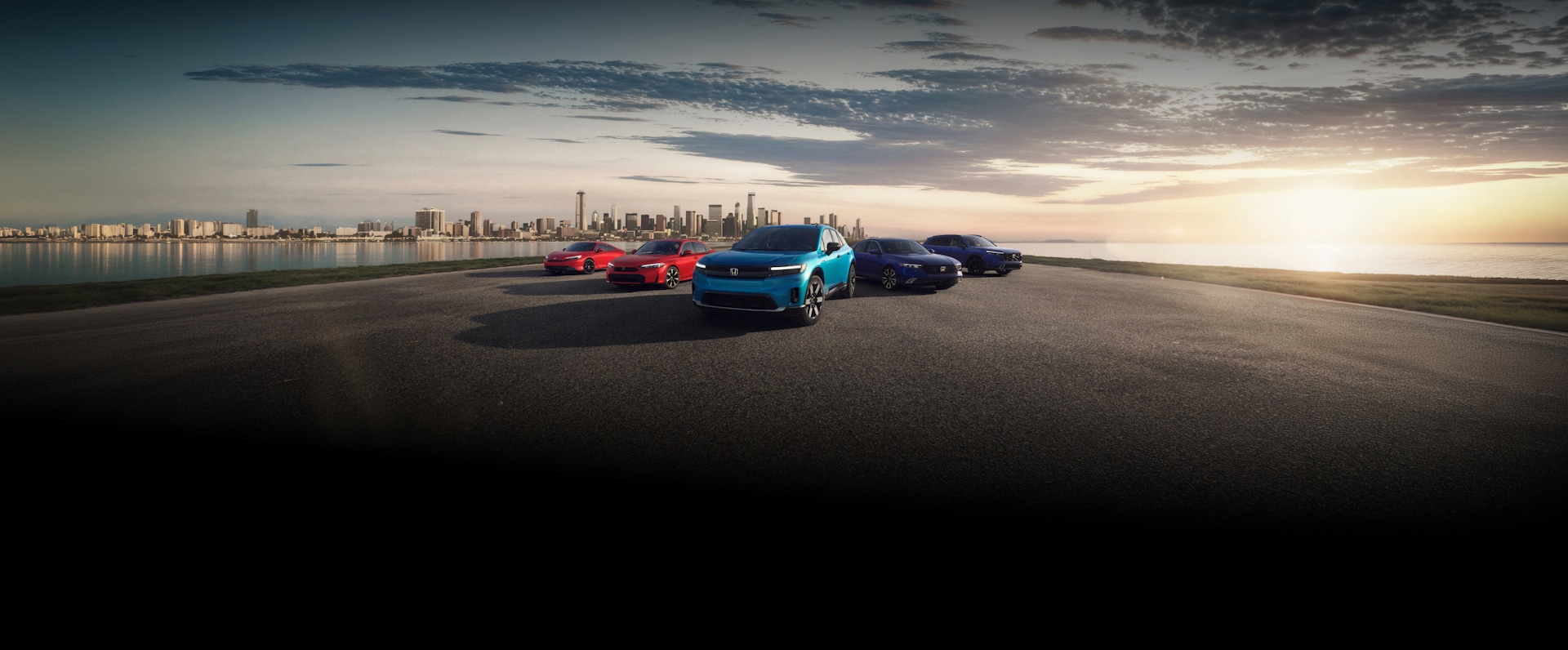2026 Honda Prelude Hybrid, Civic Sedan, Prologue, Accord, and CR-V front with a city skyline at sunset.
