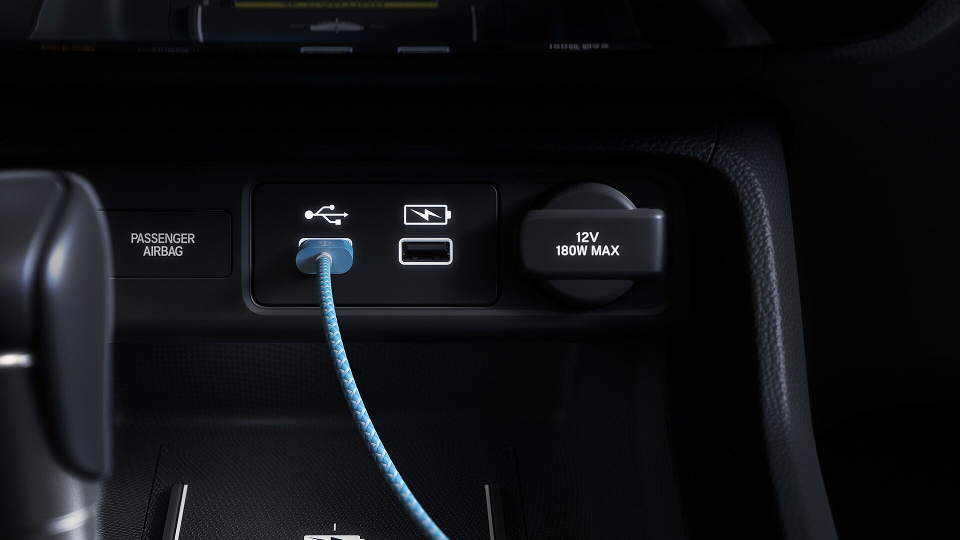 Detail view of USB ports in the 2022 Honda Civic Sport Touring Hatchback with Black Leather.