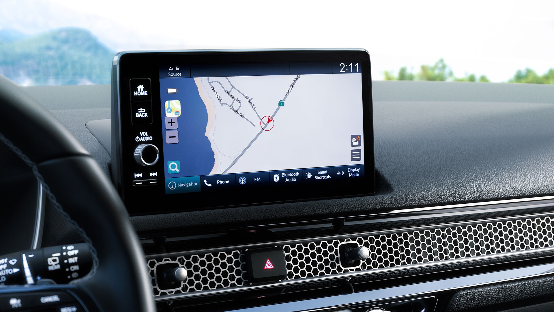 Honda Satellite-Linked Navigation System™ driving directions on the 9-inch color touch-screen in the 2022 Honda Civic Sport Touring Hatchback.