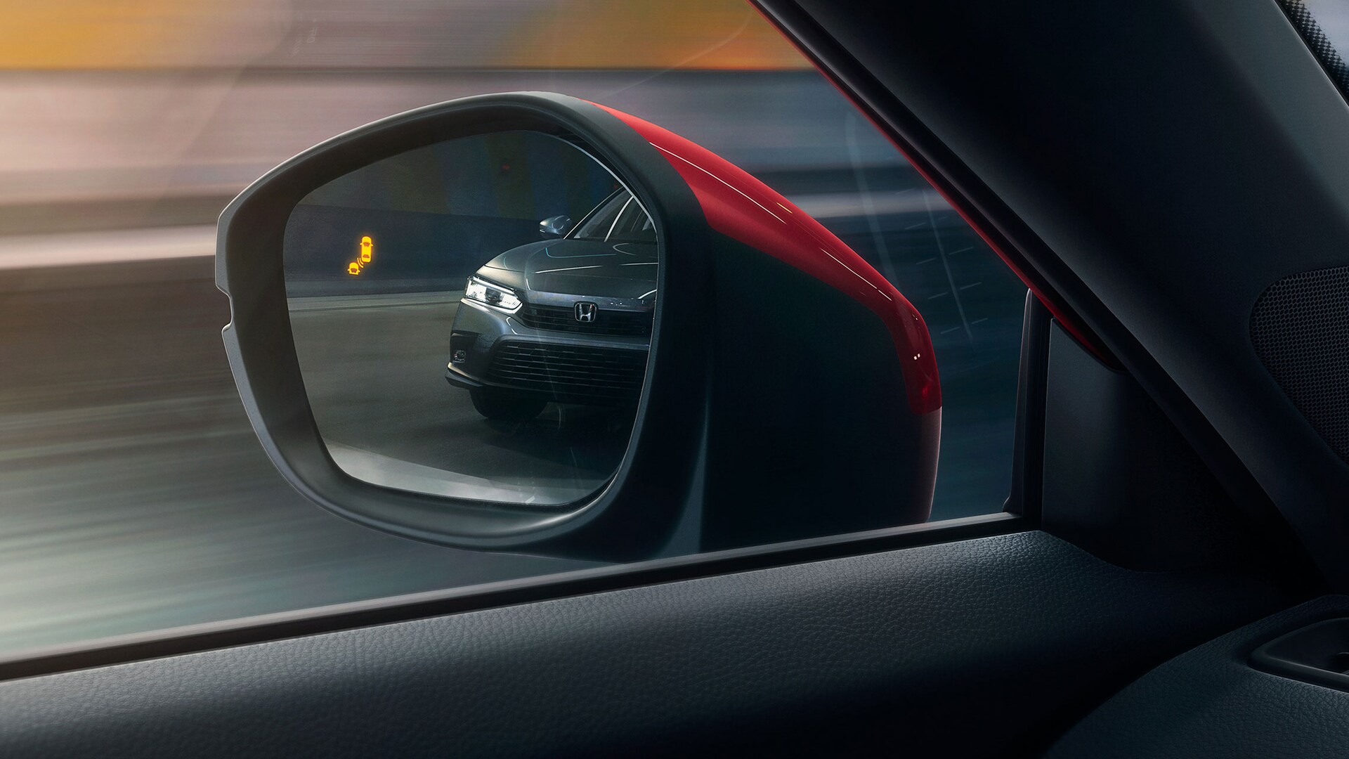Detail view of driver-side mirror with blind spot information indicator in the 2022 Honda Civic Sport Touring Hatchback.