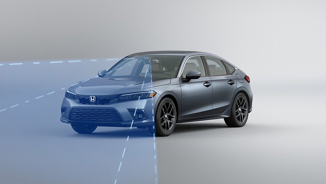 Front driver-side view of the 2022 Honda Civic Sport Touring Hatchback in Sonic Gray Pearl with illustrated lines demonstrating Honda Sensing® feature.