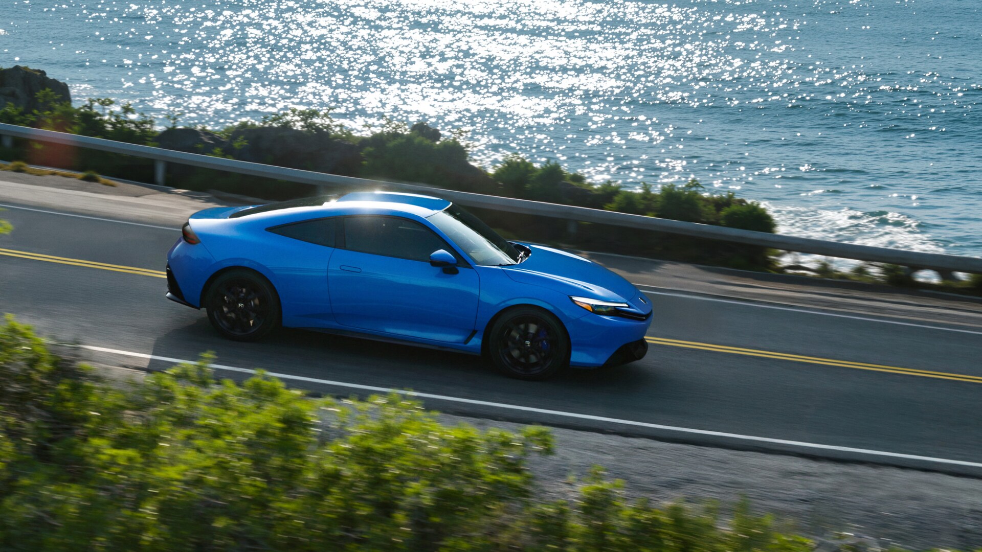 2026 Honda Prelude Hybrid driving on coastal road