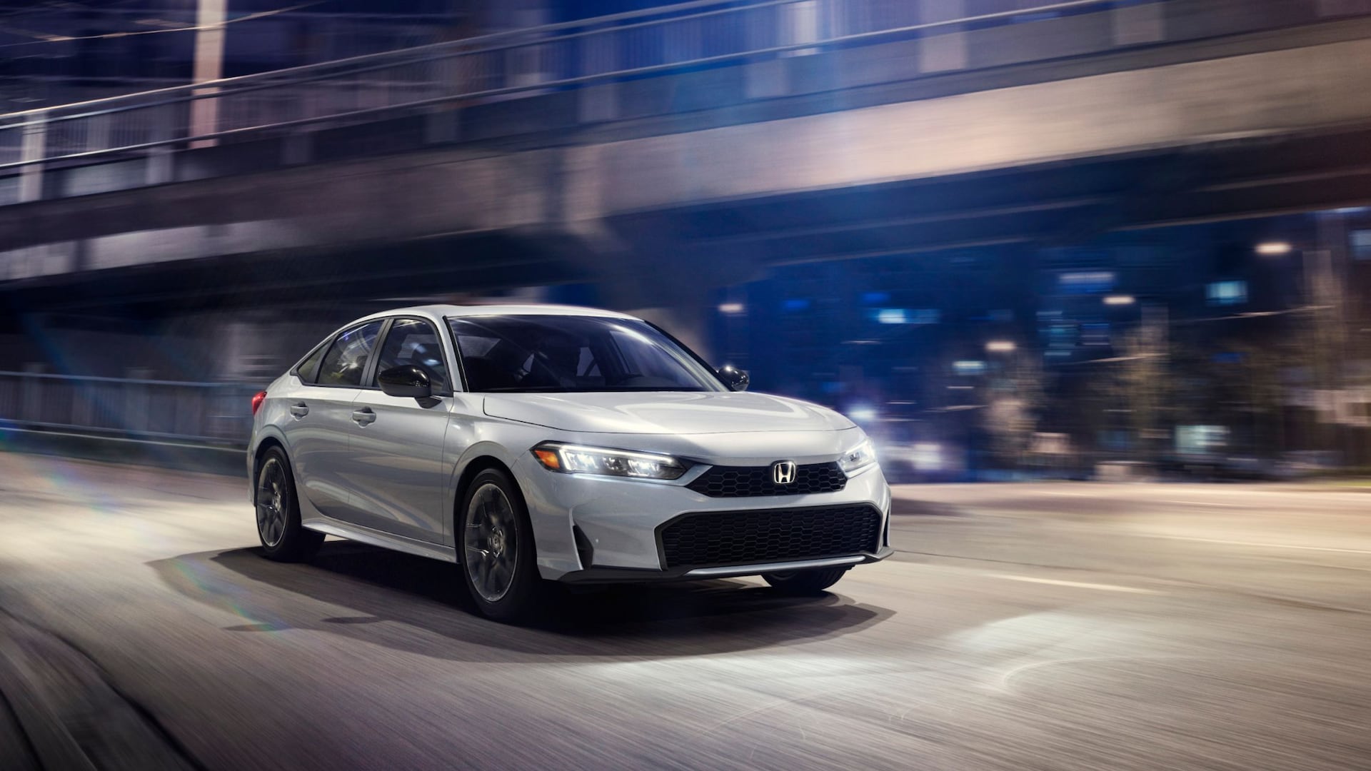 2026 Civic Sedan Sport Hybrid driving at night