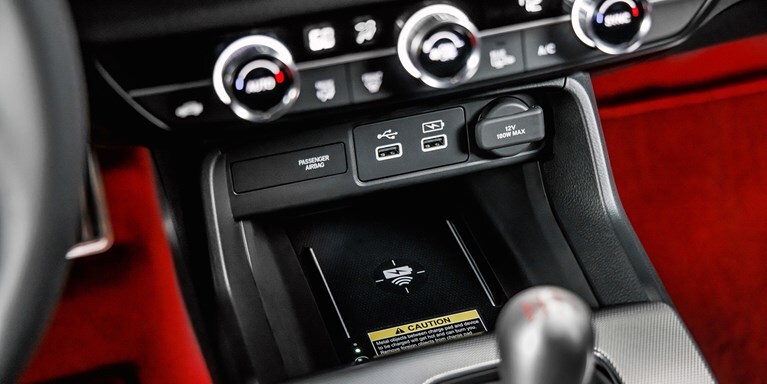 2026 Honda Civic Type R wireless phone charger and USB ports in the center console (High-Performance Hatchback).