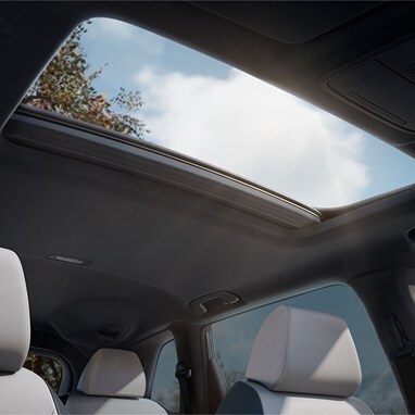 2027 Honda CR-V detail of the panoramic moonroof and interior headliner from the rear seats (Compact Crossover SUV).