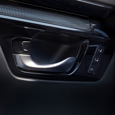 2027 Honda CR-V detail of the door handle and seat memory buttons (Compact Crossover SUV).