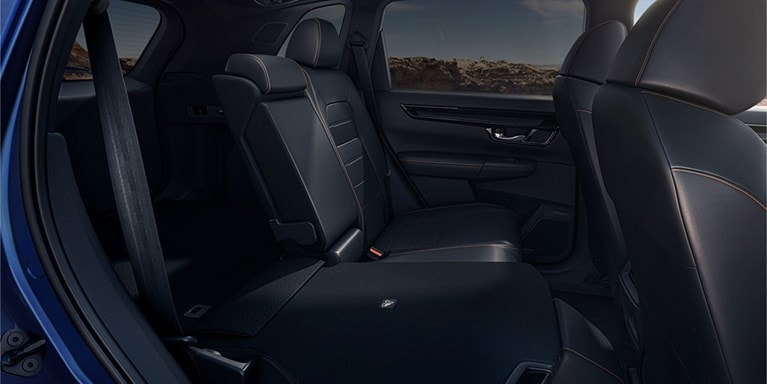 2027 Honda CR-V showing the 60/40 split rear seatback folded down for cargo (Compact Crossover SUV).