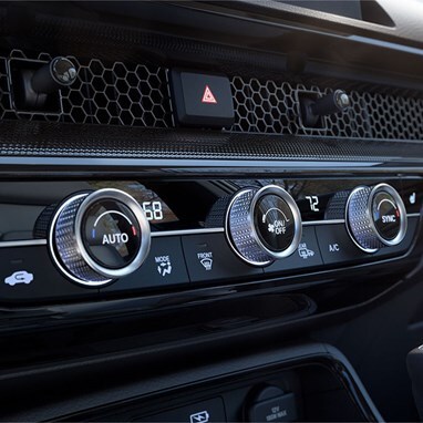 2027 Honda CR-V climate control knobs and honeycomb dashboard vents (Compact Crossover SUV).