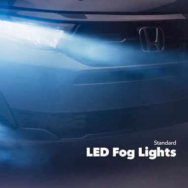 2027 Honda Odyssey Elite in Smoke Blue Pearl front studio showing standard LED fog lights and headlights (Minivan).