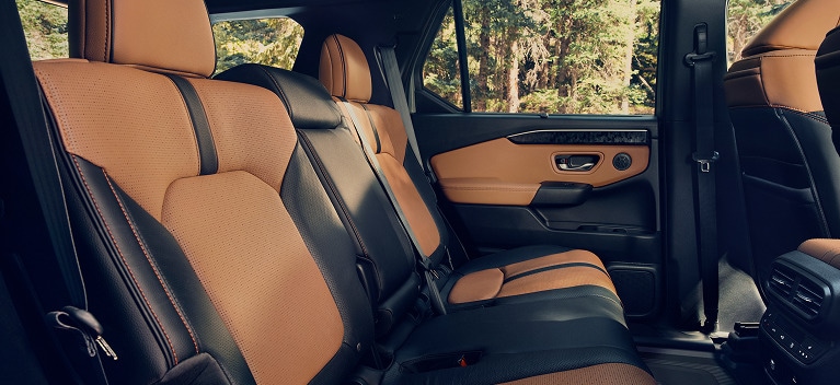 2027 Honda Passport TrailSport Elite featuring brown and black perforated leather rear seats (Mid-Size SUV).