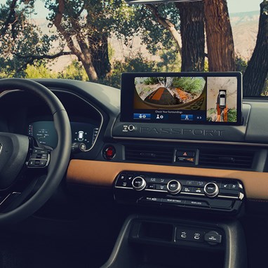 2027 Honda Passport TrailSport Elite dashboard with infotainment screen showing multi-view camera system (Mid-Size SUV).