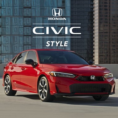 2027 Honda Civic Sedan Sport Touring Hybrid in Rallye Red front parked on a rooftop with buildings (Compact Sedan).