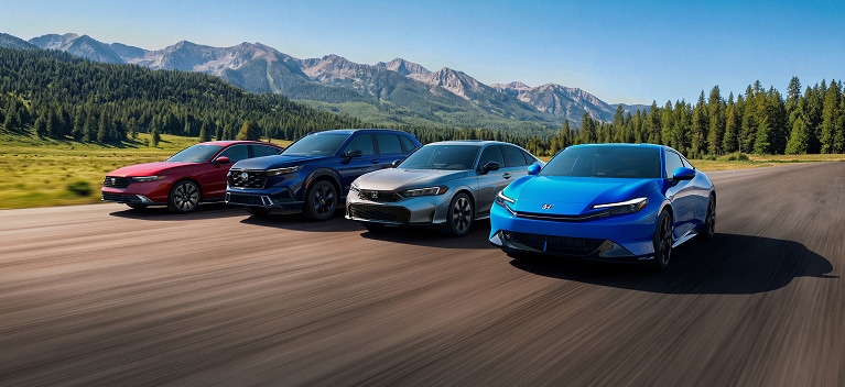 2026 Honda Hybrid models packshot, driving along a scenic mountain road with a forest backdrop.